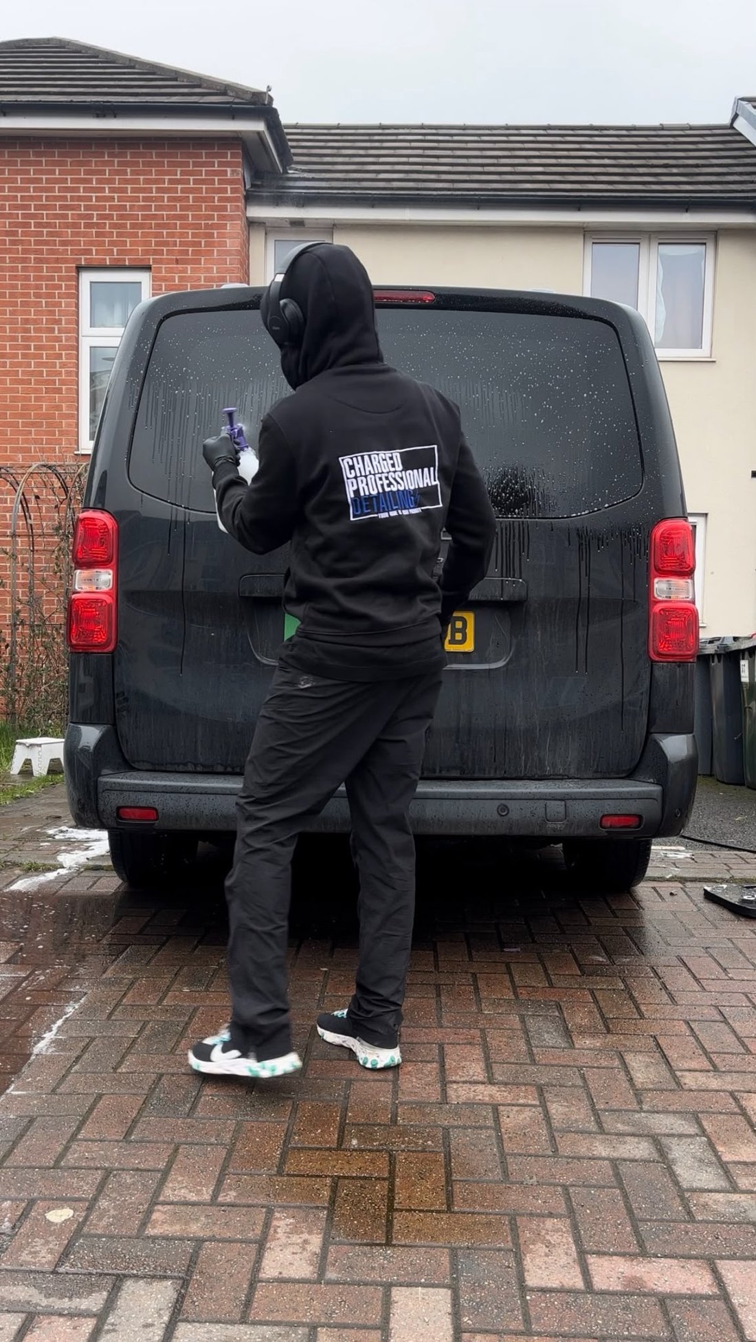 Elton, founder of Charged Professional Detailing, detailing a van
